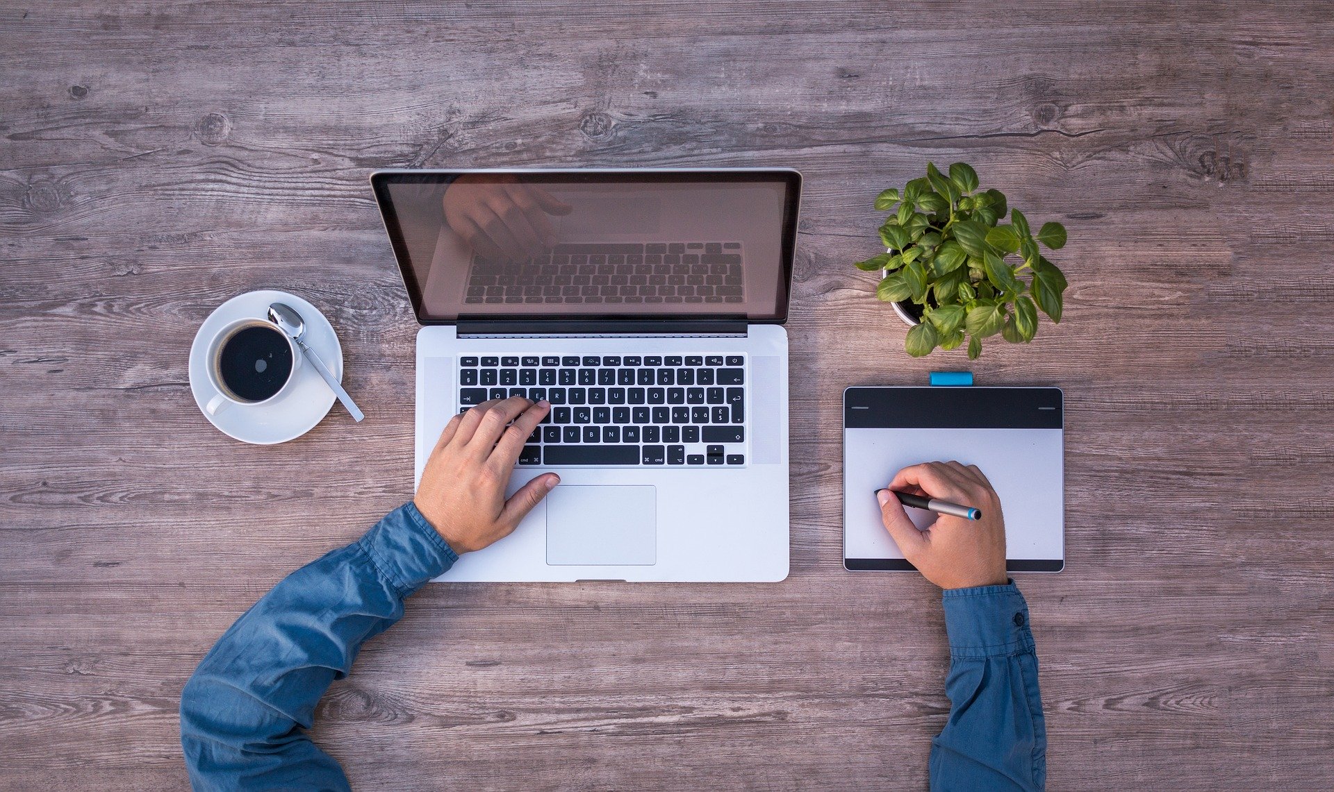 birdeye view of person sitting in front of a laptop